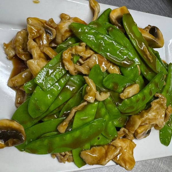 Peking Restaurant's chicken and snow peas stir-fry with mushrooms in a savory brown sauce.